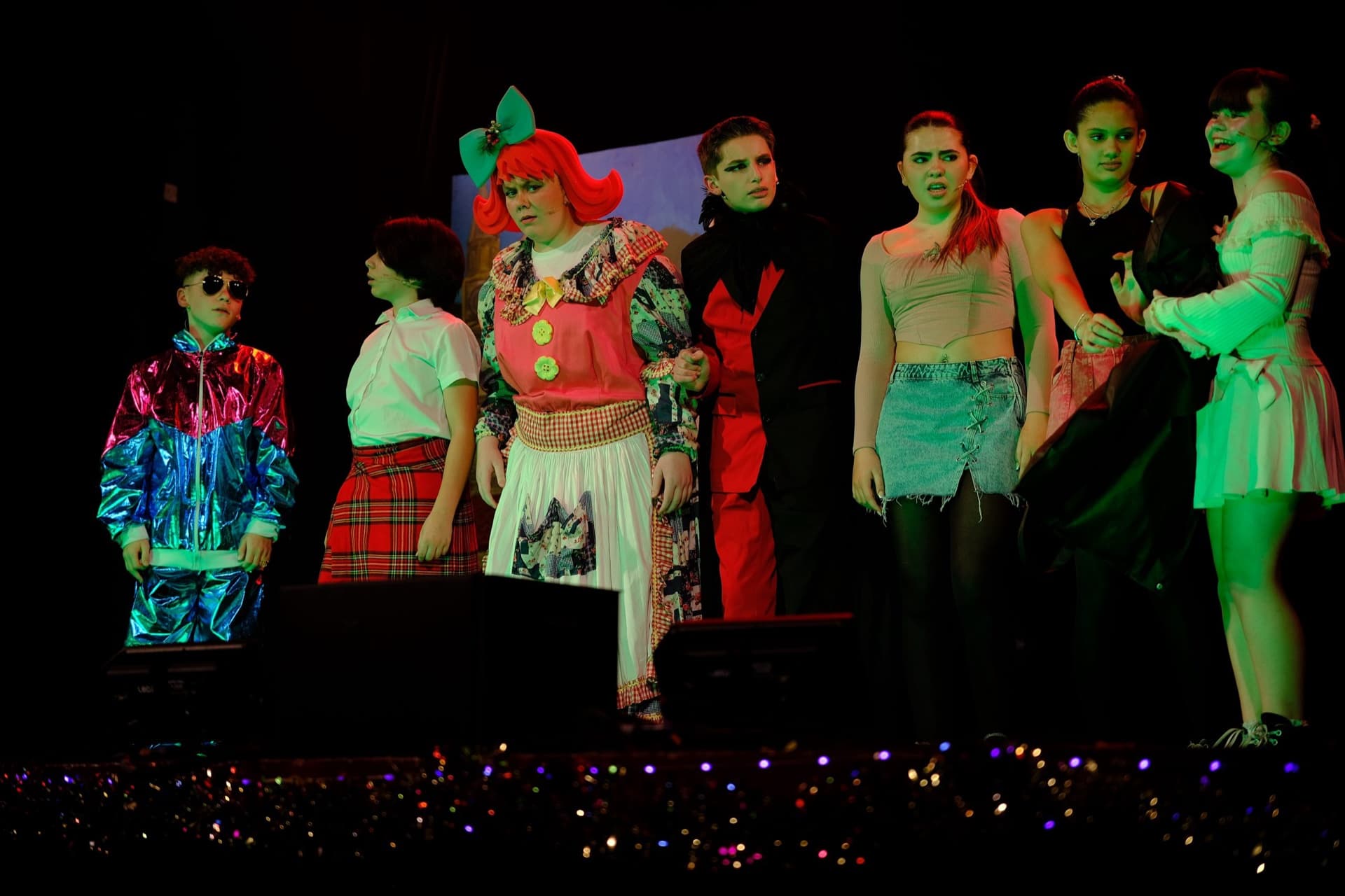 Senior cast on stage in costume during the pantomime