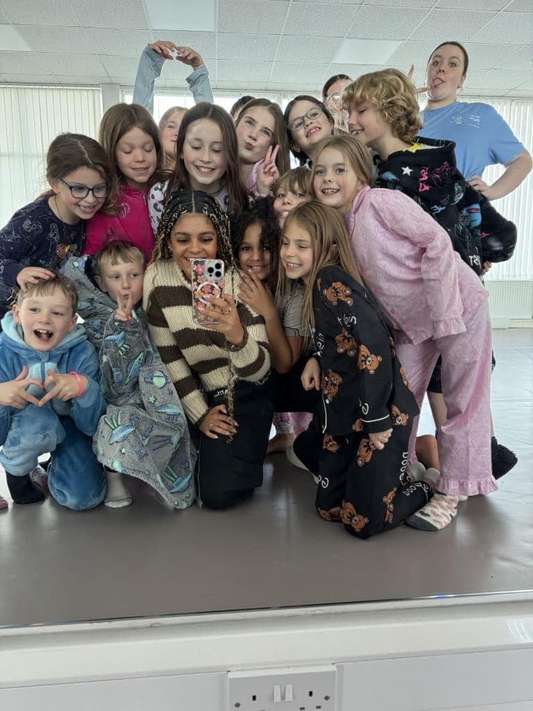 Studio class group selfie at a SOTS camp